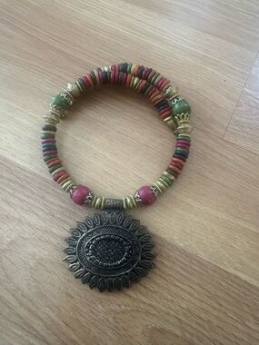 Colorful beaded Indian necklace with large metal pendant